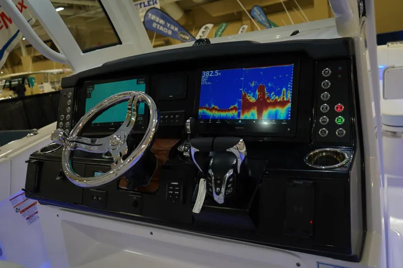Slide: The Image of 2026 Robalo R300 Center Console dashboard with advanced navigation and control systems. - 16