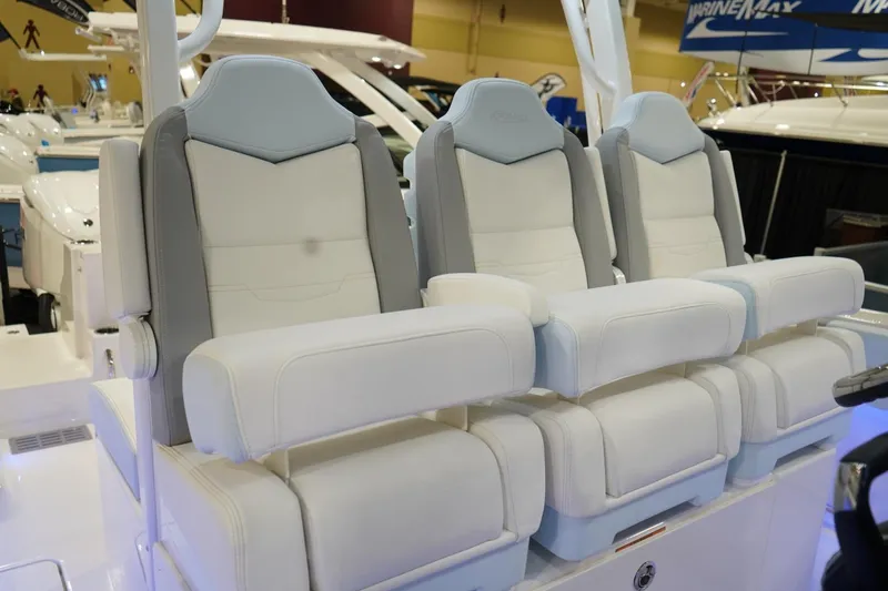 Slide: The Image of 2026 Robalo R300 Center Console boat seats, featuring luxurious white and gray upholstery. - 17