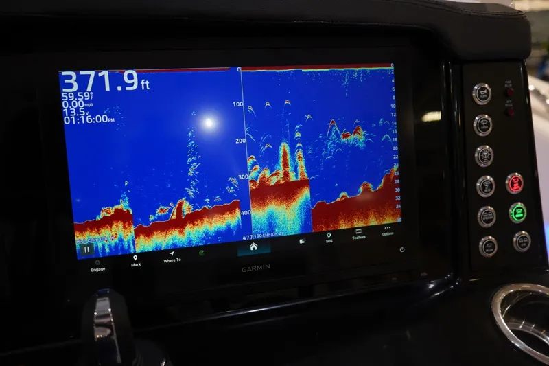 Slide: The Image of Fishfinder display on 2026 Robalo R300 Center Console boat dashboard. - 18