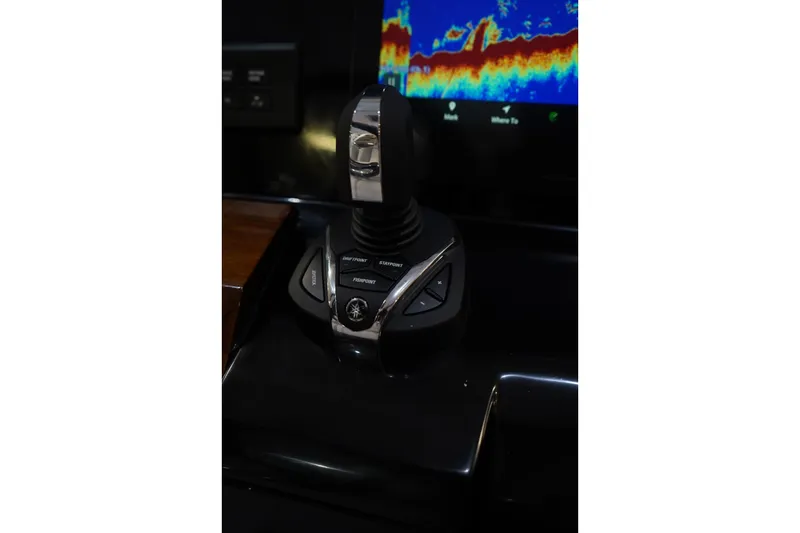 Slide: The Image of Joystick control on 2026 Robalo R300 Center Console boat dashboard. - 19