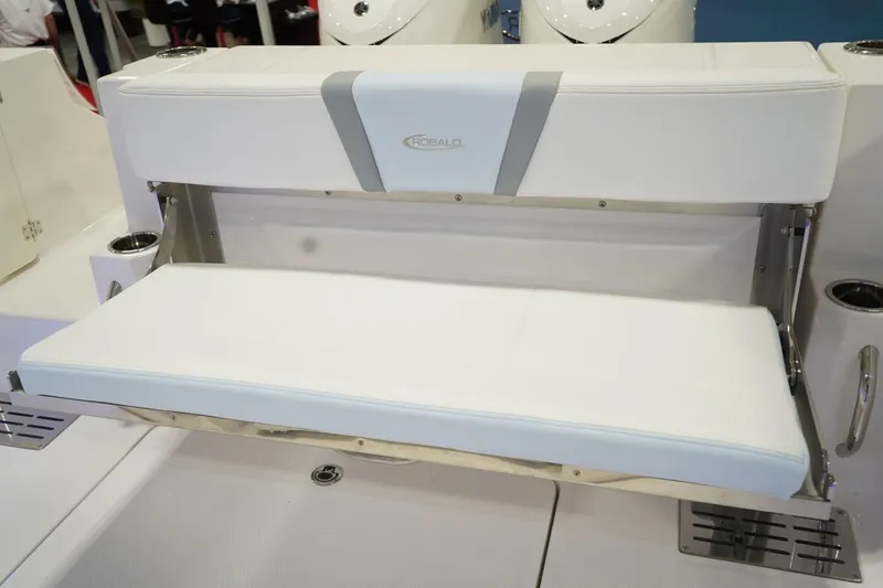 Slide: The Image of 2026 Robalo R300 Center Console boat with white fold-down seating. - 27