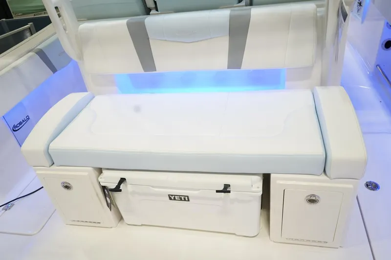 Slide: The Image of 2026 Robalo R300 Center Console boat seating with Yeti cooler and storage compartments. - 28