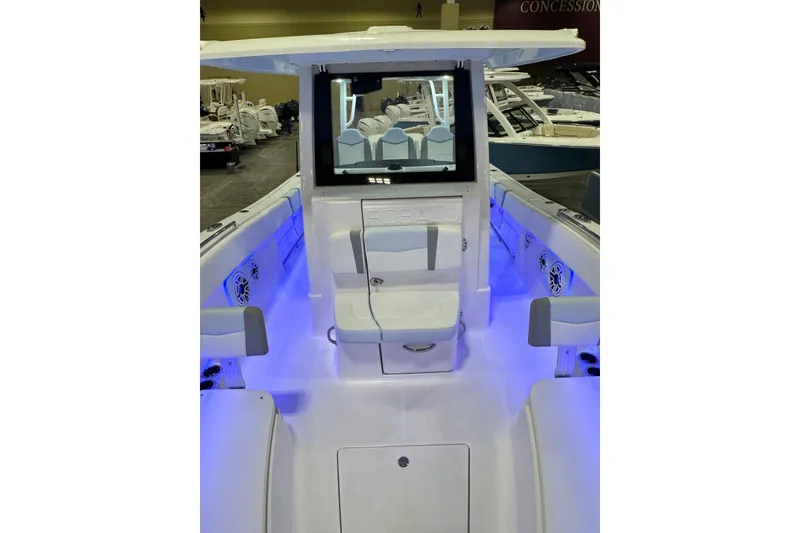 Slide: The Image of 2026 Robalo R300 Center Console boat interior with blue LED lighting. - 7