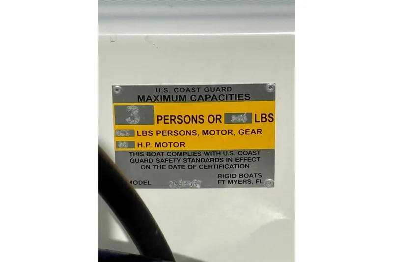 Slide: The Image of U.S. Coast Guard capacity label on 2023 Rigid Boats 10 Sport model. - 18