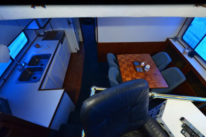 Slide: The Image of Interior of 1994 Harbor Master 46 yacht with kitchen and dining area. - 12