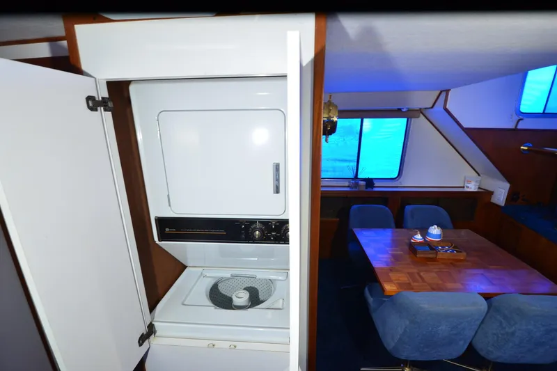 Slide: The Image of Interior of 1994 Harbor Master 46 with washer and dining area. - 16