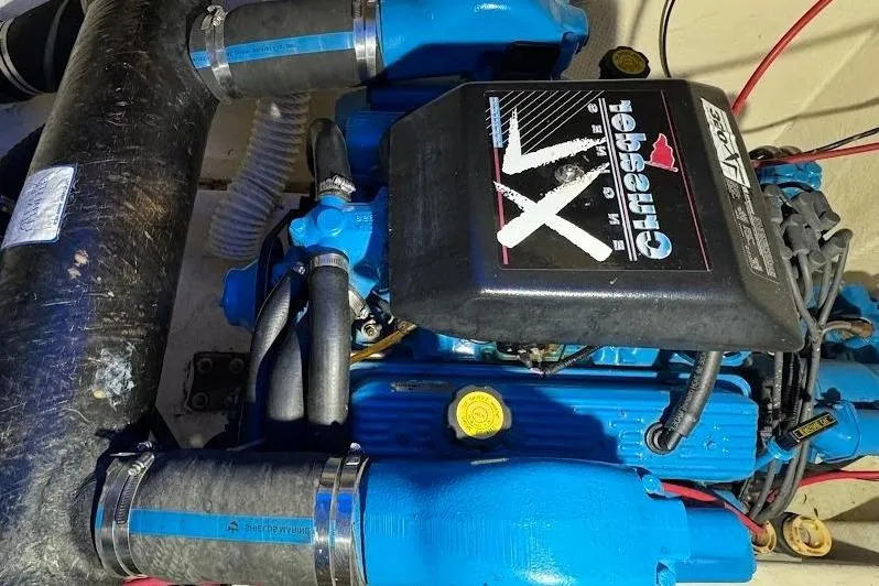 Slide: The Image of Engine of a 1994 Harbor Master 46 boat, painted blue. - 24