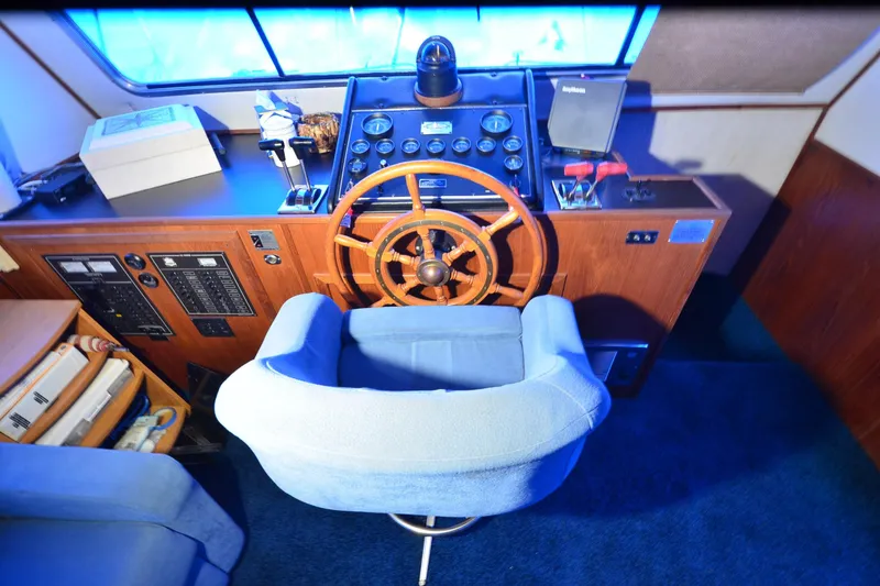 Slide: The Image of Cockpit of 1994 Harbor Master 46 with wooden steering wheel and control panel. - 6