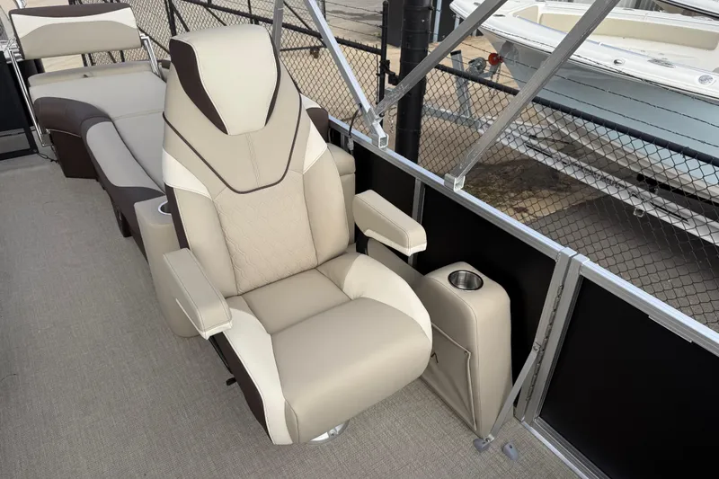 Slide: The Image of Luxurious seating on 2026 Avalon LSZ Quad Lounger Shift boat, featuring beige and brown upholstery. - 14