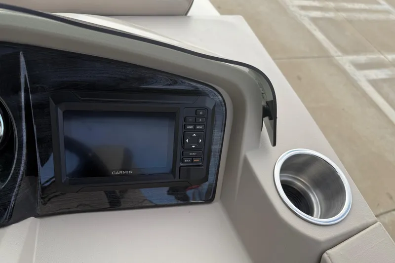 Slide: The Image of Dashboard of 2026 Avalon LSZ Quad Lounger Shift with Garmin display and cup holder. - 22