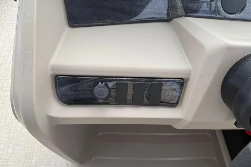 Slide: The Image of 2026 Avalon LSZ Quad Lounger Shift dashboard with 12V power outlet and sleek design. - 24