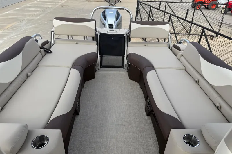 Slide: The Image of 2026 Avalon LSZ Quad Lounger Shift boat interior with luxurious seating and cup holders. - 27