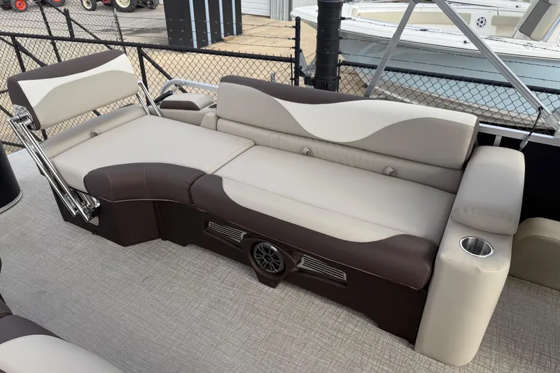 Slide: The Image of 2026 Avalon LSZ Quad Lounger Shift boat interior with luxurious seating and cup holder. - 40