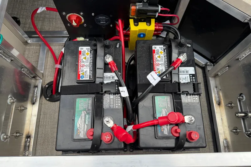 Slide: The Image of Dual marine batteries in Avalon LSZ QUAD LOUNGER SHIFT 2026, secured with cables and connectors. - 42