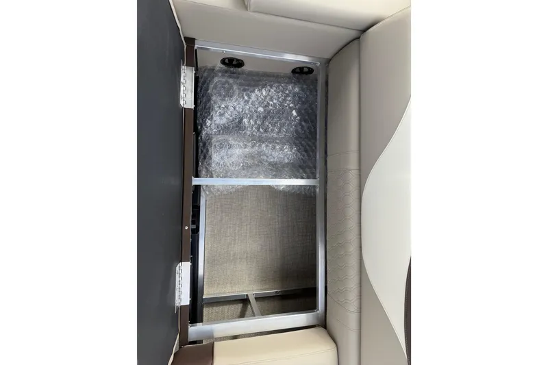 Slide: The Image of Interior storage compartment of 2026 Avalon LSZ Quad Lounger Shift boat. - 44