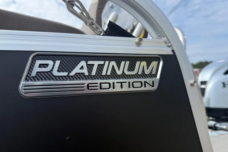 Slide: The Image of 2026 Avalon LSZ QUAD LOUNGER SHIFT Platinum Edition badge on boat exterior. - 5