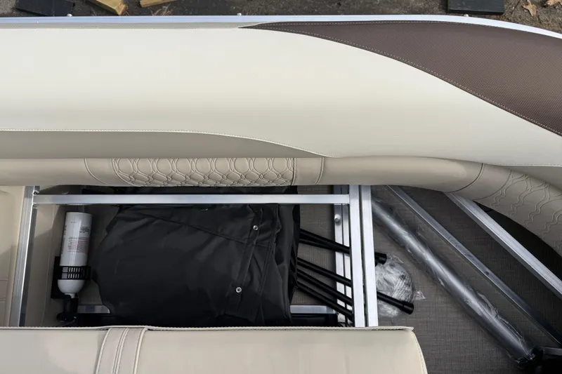 Slide: The Image of Avalon LSZ Quad Lounger Shift 2026 boat seat storage with accessories and fire extinguisher. - 50