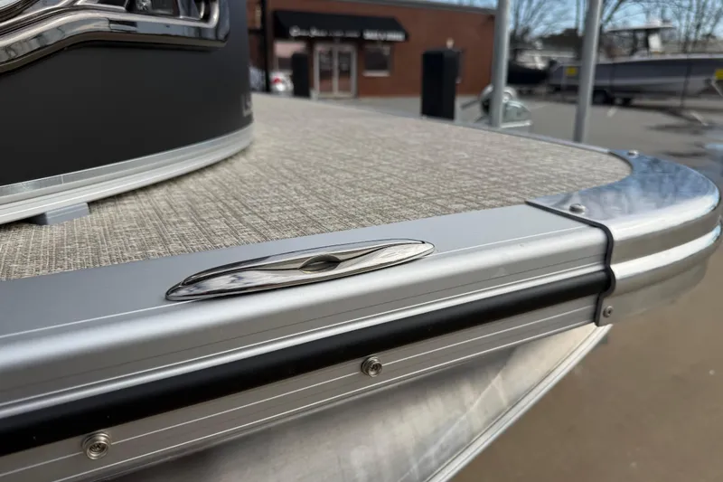 Slide: The Image of 2026 Avalon LSZ Quad Lounger Shift boat detail with sleek metal finish. - 56