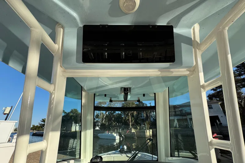 Slide: The Image of 2023 Boston Whaler 250 Outrage boat interior with clear view of water and surroundings. - 15