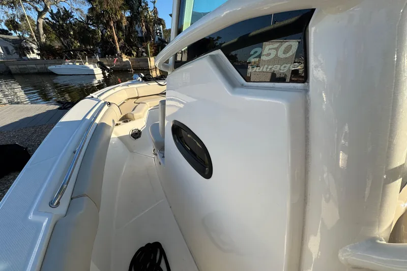 Slide: The Image of 2023 Boston Whaler 250 Outrage boat interior, showcasing sleek design and spacious seating. - 18