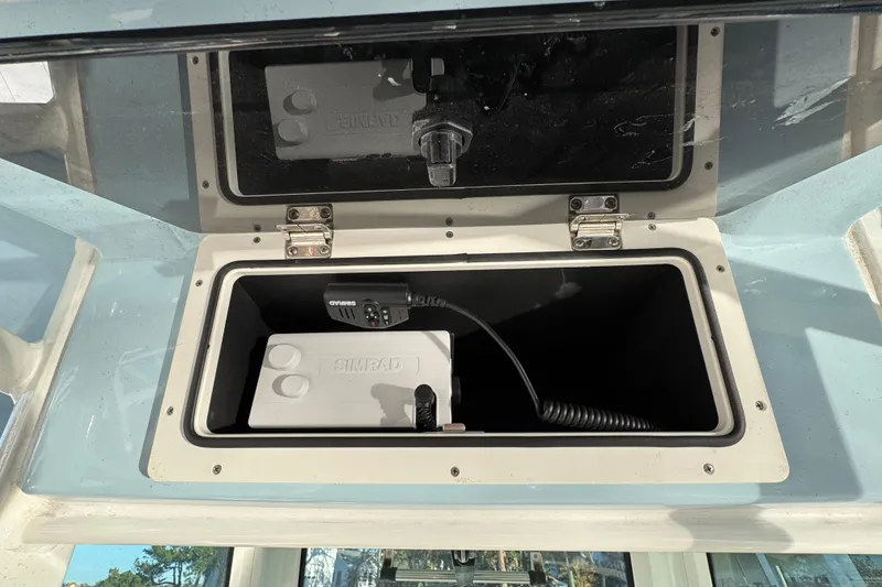 Slide: The Image of Storage compartment on 2023 Boston Whaler 250 Outrage with Simrad marine equipment. - 27