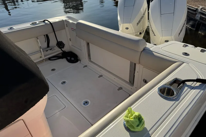 Slide: The Image of 2023 Boston Whaler 250 Outrage boat interior with dual Mercury engines. - 7