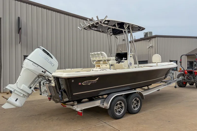 Slide: The Image of 2026 Bulls Bay 2400 boat on trailer with Suzuki outboard motor. - 12