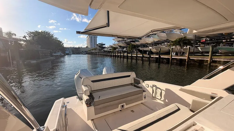 Slide: The Image of Interior view of Tiara Sport 34 LS yacht, 2023 model, by the water. - 20