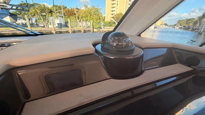 Slide: The Image of Compass on the dashboard of Tiara Sport 34 LS, 2023. - 23