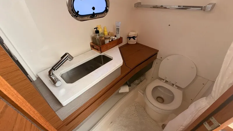 Slide: The Image of Luxurious bathroom in Tiara Sport 34 LS boat, 2023 model. - 25