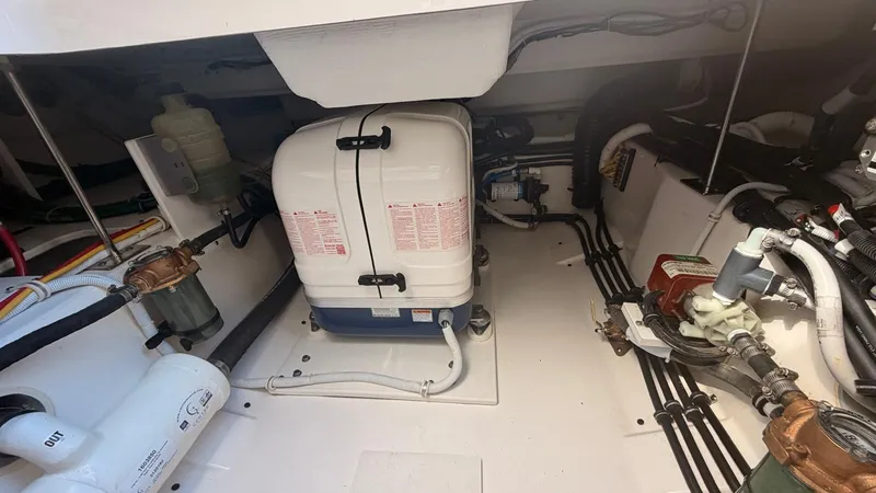 Slide: The Image of Engine compartment of 2023 Tiara Sport 34 LS with technical components. - 32