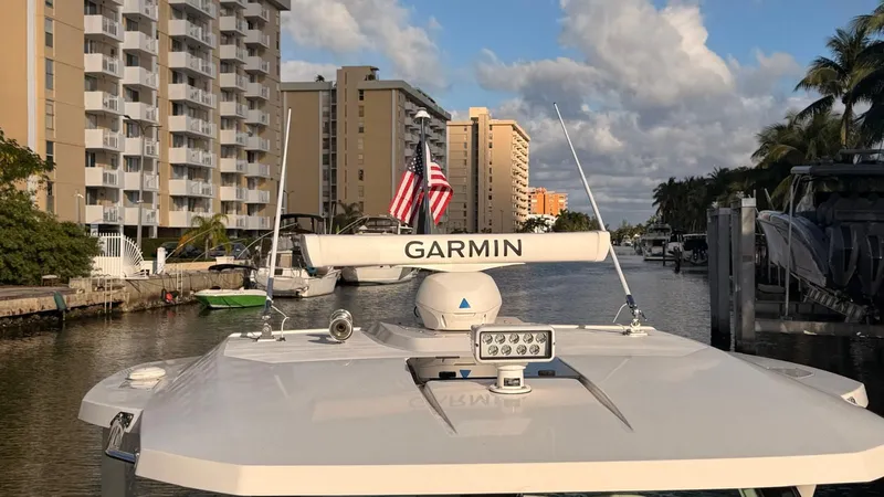 Slide: The Image of Tiara Sport 34 LS 2023 boat with Garmin equipment in a canal. - 35