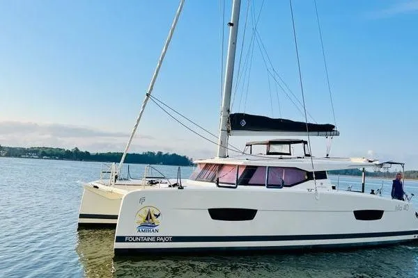 Slide: The Image of 2023 Fountaine Pajot Isla 40 catamaran sailing on calm waters. - 12