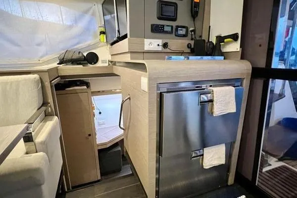 Slide: The Image of Interior of 2023 Fountaine Pajot Isla 40 catamaran with modern kitchen amenities. - 16