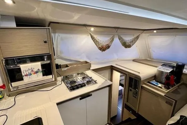Slide: The Image of Modern kitchen interior of 2023 Fountaine Pajot Isla 40 catamaran with appliances and storage. - 18