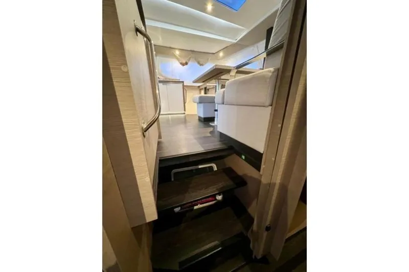 Slide: The Image of Interior view of 2023 Fountaine Pajot Isla 40 catamaran, featuring modern design and comfortable seating. - 19