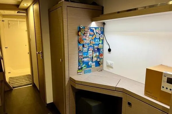 Slide: The Image of Interior of 2023 Fountaine Pajot Isla 40 catamaran with desk and storage area. - 20