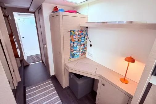 Slide: The Image of Interior of 2023 Fountaine Pajot Isla 40 catamaran with modern desk and vibrant decor. - 22