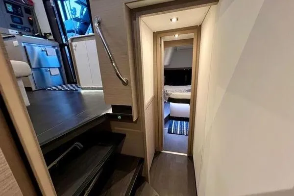 Slide: The Image of 2023 Fountaine Pajot Isla 40 interior hallway with modern design and cozy bedroom view. - 26