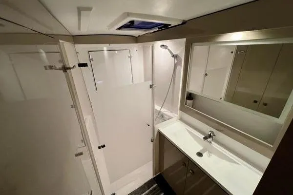 Slide: The Image of Modern bathroom in 2023 Fountaine Pajot Isla 40 catamaran with shower and sleek vanity. - 36