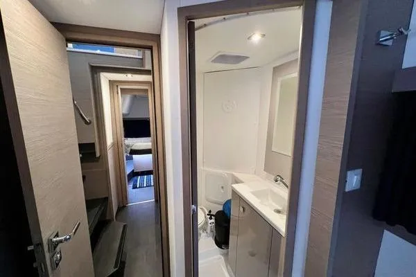 Slide: The Image of 2023 Fountaine Pajot Isla 40 yacht interior with modern bathroom and cozy cabin. - 37