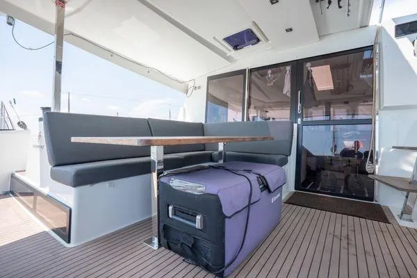 Slide: The Image of 2023 Fountaine Pajot Isla 40 yacht interior with seating and table on deck. - 47