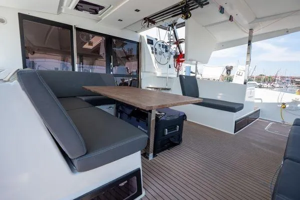 Slide: The Image of 2023 Fountaine Pajot Isla 40 catamaran interior with seating and table. - 50