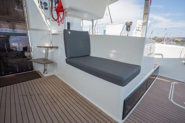 Slide: The Image of 2023 Fountaine Pajot Isla 40 yacht seating area with modern design and wooden flooring. - 52