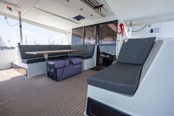 Slide: The Image of 2023 Fountaine Pajot Isla 40 yacht interior with modern seating and table arrangement. - 55