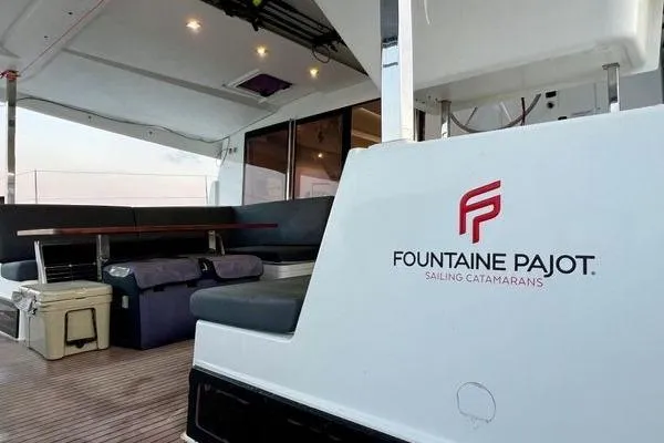 Slide: The Image of 2023 Fountaine Pajot Isla 40 catamaran interior with seating and logo. - 56