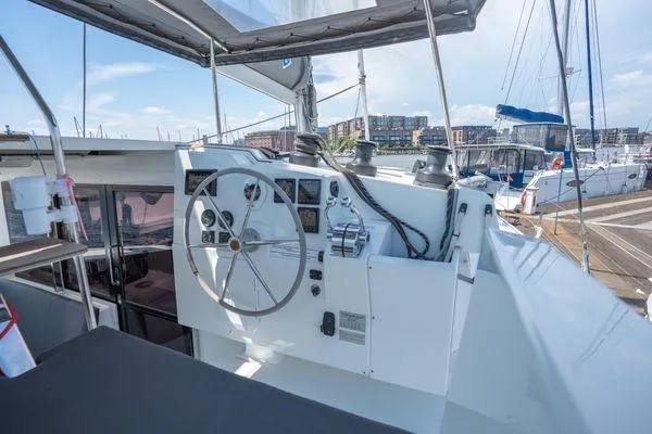 Slide: The Image of Helm of 2023 Fountaine Pajot Isla 40 catamaran docked at marina. - 58