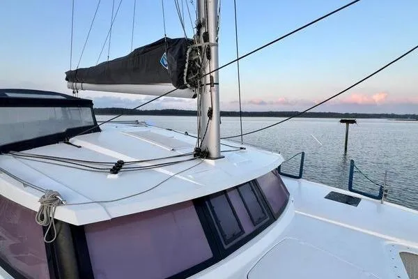Slide: The Image of 2023 Fountaine Pajot Isla 40 catamaran on calm water at sunset. - 67