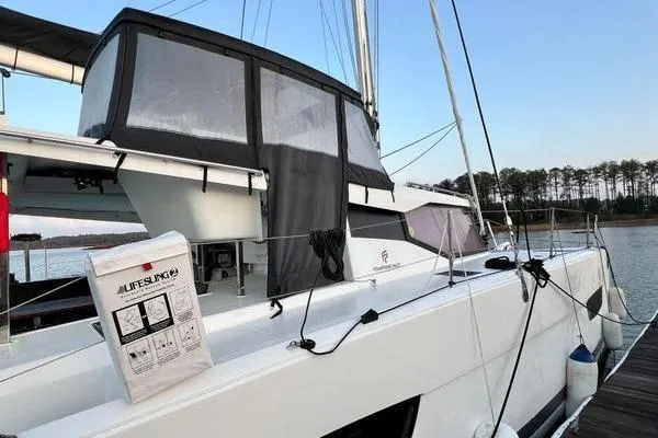 Slide: The Image of 2023 Fountaine Pajot Isla 40 catamaran docked, featuring sleek design and modern amenities. - 7