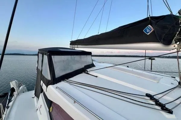 Slide: The Image of 2023 Fountaine Pajot Isla 40 catamaran on calm water at sunset. - 70